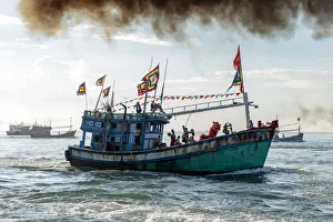 A fishing trawler at sea, taking part in the annual whale festival, with a lion dance A fishing trawler at sea, taking part in the annual whale festival, with a lion dance