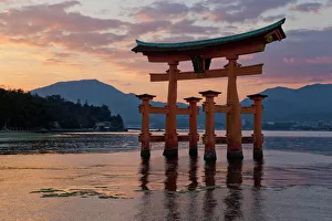 The floating Miyajima torii gate of Itsukushima Shrine at sunset, UNESCO World Heritage Site The floating Miyajima torii gate of Itsukushima Shrine at sunset, UNESCO World Heritage Site