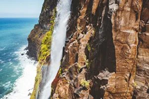 Flowing water of Bridal Veil Fall jumping from rocks, Seixal, Madeira island, Portugal Flowing water of Bridal Veil Fall jumping from rocks, Seixal, Madeira island, Portugal