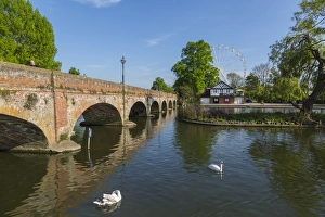Footbridge over River Avon and ferris wheel, Stratford upon Avon, Warwickshire, England Footbridge over River Avon and ferris wheel, Stratford upon Avon, Warwickshire, England