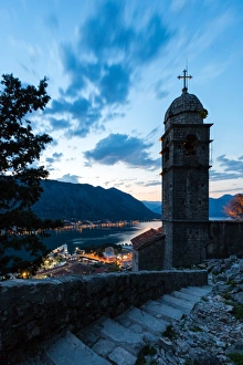 Part of the fortress walls and path above the old town of Kotor during the evening blue hour Part of the fortress walls and path above the old town of Kotor during the evening blue hour