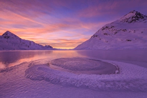 Frost creating unusual shapes in the middle of Lake Bianco at Bernina illuminated by the light of sunrise, Graubunden, Swiss Alps, Switzerland, Europe Frost creating unusual shapes in the middle of Lake Bianco at Bernina illuminated by the light of sunrise, Graubunden, Swiss Alps, Switzerland, Europe