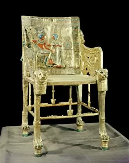 Artifact Gallery: The gilt throne, the back decorated with a scene showing the royal couple