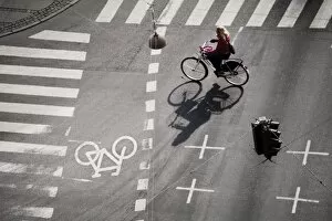 Commuter Gallery: Girl on bicycle at crossroads, Copenhagen, Denmark, Scandinavia, Europe