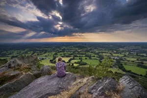 A girl looks out over the Cheshire Plain from Bosley Cloud, Cheshire, England, United Kingdom, Europe