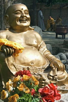 Laughing Collection: A golden Buddha statue at Shaolin Temple, birthplace of Kung Fu martial arts