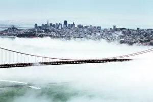 Golden Gate Bridge and the San Francisco skyline floating above the fog on a foggy day in San Francisco, California