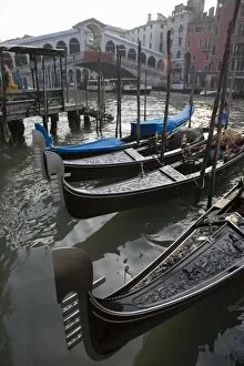 Rialto Bridge, Venice Gallery: Gondolas moored on Grand Canal near Rialto Bridge, Venice, UNESCO World Heritage Site