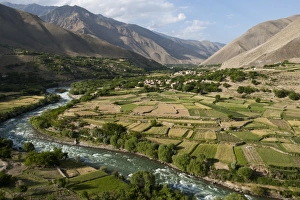 The green of the irrigated fields contrasts with the arid hills above, a testament The green of the irrigated fields contrasts with the arid hills above, a testament