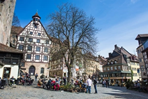 Half timbered houses and open air cafes on Albrecht Duerer square in the medieval Half timbered houses and open air cafes on Albrecht Duerer square in the medieval