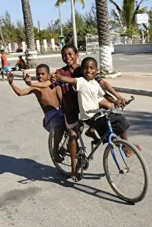 Toliara Collection: Happy boys cycling through the streets of Toliara, Madagascar, Africa