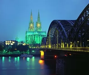 German Culture Gallery: Hohenzollernbrucke and the Cathedral Illuminated at Night, Cologne, Germany