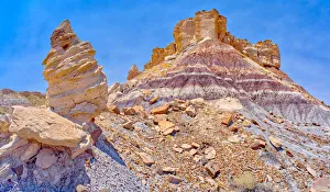 A hoodoo formation called Medusa's Child below the cliffs of Agate Plateau in A hoodoo formation called Medusa's Child below the cliffs of Agate Plateau in