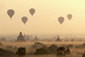 Burma Collection: Hot air ballons fly over ancient temples at dawn in Bagan (Pagan), Myanmar (Burma), Asia