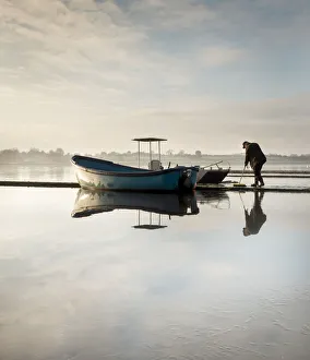 East Yorkshire Gallery: A very icy cold morning on Hornsea Mere as the boats and jetty are prepared for the