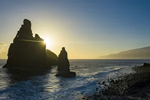 Ilheus da Rib and Ribeira da Janela rock formations lit by sun rays at dawn Ilheus da Rib and Ribeira da Janela rock formations lit by sun rays at dawn