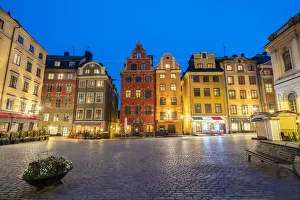 Illuminated historic buildings at dusk, Stortorget Square, Gamla Stan, Stockholm, Sweden Illuminated historic buildings at dusk, Stortorget Square, Gamla Stan, Stockholm, Sweden
