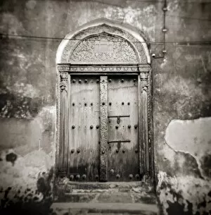 Stone Town of Zanzibar Gallery: Image taken with a Holga medium format 120 film toy camera of old Omani studded timber door