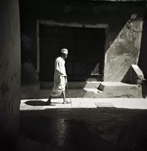 Stone Town of Zanzibar Gallery: Image taken with a Holga medium format 120 film toy camera of a man in white djellaba caught in