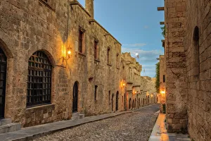 Inns at dusk, Street of the Knights, blue hour, Medieval Old Rhodes Town, UNESCO Inns at dusk, Street of the Knights, blue hour, Medieval Old Rhodes Town, UNESCO