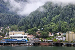 Juneau, State Capital, view from the sea, mist clears over downtown buildings, mountains Juneau, State Capital, view from the sea, mist clears over downtown buildings, mountains