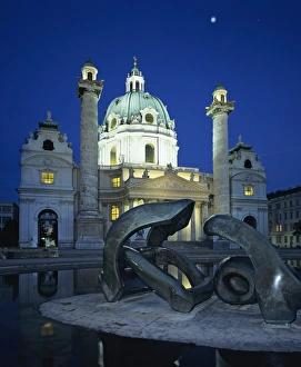 Karlskirche at night with Henry Moore sculpture in foreground, Vienna, Austria, Europe Karlskirche at night with Henry Moore sculpture in foreground, Vienna, Austria, Europe