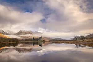 Kilchurn Castle reflected in Loch Awe at dawn in winter, Highlands, Scotland Kilchurn Castle reflected in Loch Awe at dawn in winter, Highlands, Scotland
