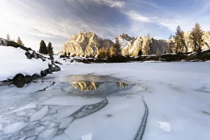 Lagazuoi mountain mirrored in the icy lake Limides at dawn, Ampezzo Dolomites Lagazuoi mountain mirrored in the icy lake Limides at dawn, Ampezzo Dolomites