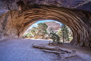 Landscape view through Navajo Arch, Arches National Park, Utah, United States of America Landscape view through Navajo Arch, Arches National Park, Utah, United States of America