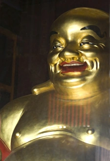 Large golden smiling Buddha in Kek Lok Si Buddhist temple, Air Itam, Georgetown Large golden smiling Buddha in Kek Lok Si Buddhist temple, Air Itam, Georgetown