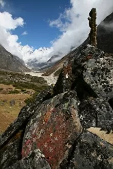 Lichen grows on an old Buddhist mani wall (prayer wall) constructed on the trail from Lukla to Tangnag, near Mera Peak