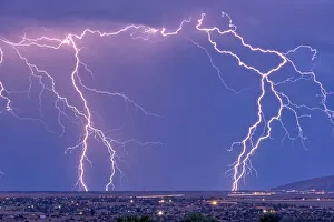 Lightning bolts striking Prescott area in the distance with the town of Chino Valley just Lightning bolts striking Prescott area in the distance with the town of Chino Valley just