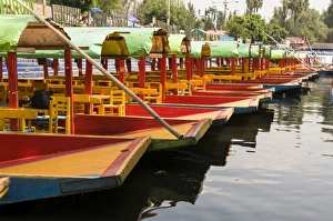 Line of colourful boats at the Floating Gardens in Xochimilco, UNESCO World Heritage Site Line of colourful boats at the Floating Gardens in Xochimilco, UNESCO World Heritage Site