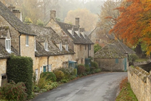 Line of Cotswold stone cottages in autumn mist, Snowshill, Cotswolds, Gloucestershire Line of Cotswold stone cottages in autumn mist, Snowshill, Cotswolds, Gloucestershire