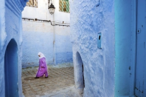 Local women walking through the blue streets of the Medina, Chefchaouen, Morocco Local women walking through the blue streets of the Medina, Chefchaouen, Morocco