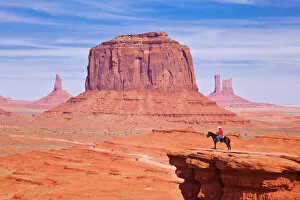 Lone horse rider at John Fords Point, Merrick Butte, Monument Valley Navajo Tribal Park, Arizona