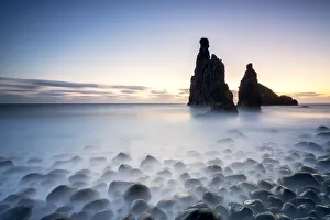 Long exposure of waves crashing on Ilheus da Rib and Ribeira da Janela rock formations at Long exposure of waves crashing on Ilheus da Rib and Ribeira da Janela rock formations at