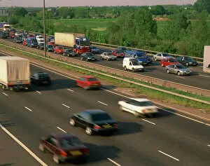 Lorries, vans and cars in a traffic jam on a motorway, United Kingdom, Europe
