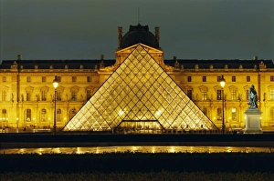 Prints of The Louvre and pyramid illuminated at night, Paris, France, Europe Paris Prints: The Louvre Pyramid Print