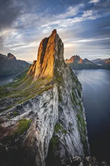 Majestic Mount Segla and fjords under a cloudy sky at sunrise, Senja island,Troms county Majestic Mount Segla and fjords under a cloudy sky at sunrise, Senja island,Troms county