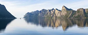 Majestic mountains Segla and Hesten along the unspoiled waters of Mefjord, Senja Majestic mountains Segla and Hesten along the unspoiled waters of Mefjord, Senja