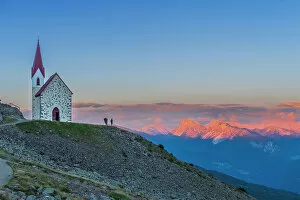 Places Of Worship Gallery: Man enjoys sunset over Dolomites at the pilgrimage church of Lazfons, Chiusa, Bolzano district