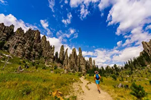 Man hiking the trails and enjoying the sights in the Black Hills of Keystone Man hiking the trails and enjoying the sights in the Black Hills of Keystone