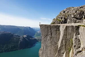 One Man Only Gallery: Man standing on Preikestolen (Pulpit Rock) above fjord, Lysefjord, Norway