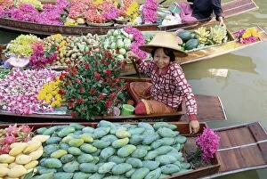 Merchandise Gallery: Market trader in boat selling flowers and fruit