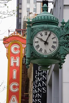 Theatres Gallery: The Marshall Field Building Clock and Chicago Theatre behind, Chicago, Illinois