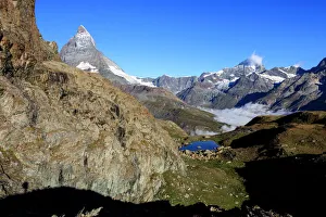 Matterhorn and Dent Blanche and the blue waters of Lake Riffelsee, Zermatt, Canton of Valais Matterhorn and Dent Blanche and the blue waters of Lake Riffelsee, Zermatt, Canton of Valais