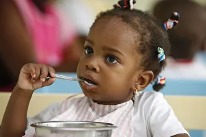 Meal time at a nursery and kindergarten run by Catholic nuns, Lome, Togo, West Africa Meal time at a nursery and kindergarten run by Catholic nuns, Lome, Togo, West Africa