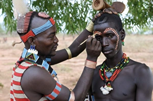 Two men from the Hamer tribe preparing for the Jumping of the Bull ceremony Two men from the Hamer tribe preparing for the Jumping of the Bull ceremony