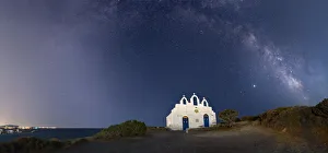 Milky Way arches above Agios Georgios on Paros Island, Cyclades, Greek Islands, Greece Milky Way arches above Agios Georgios on Paros Island, Cyclades, Greek Islands, Greece